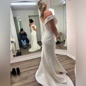 BRAND NEW - NEVER WORN 

beautiful off the shoulder wedding gown with train